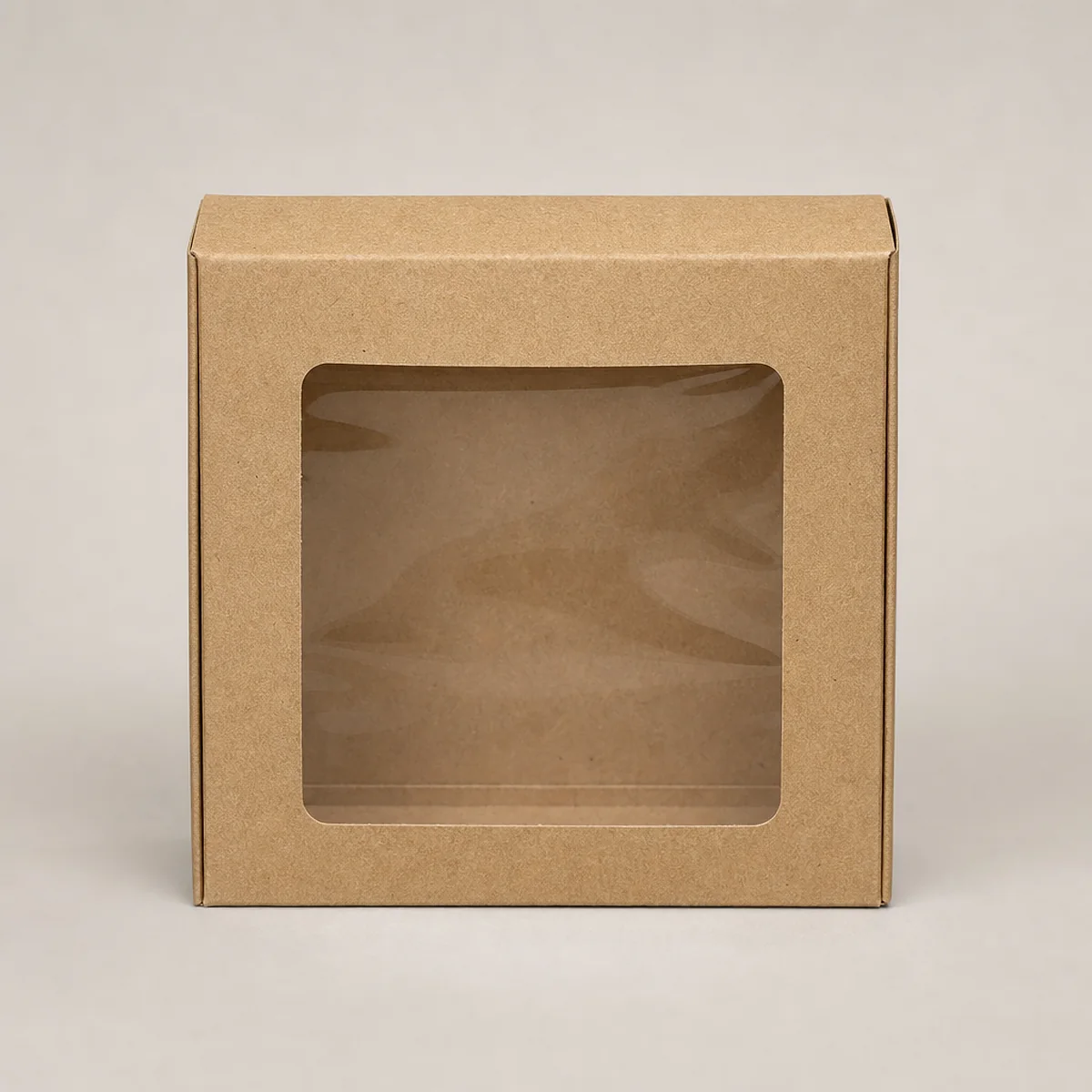 Kraft candle box with a die-cut window showing a glass jar